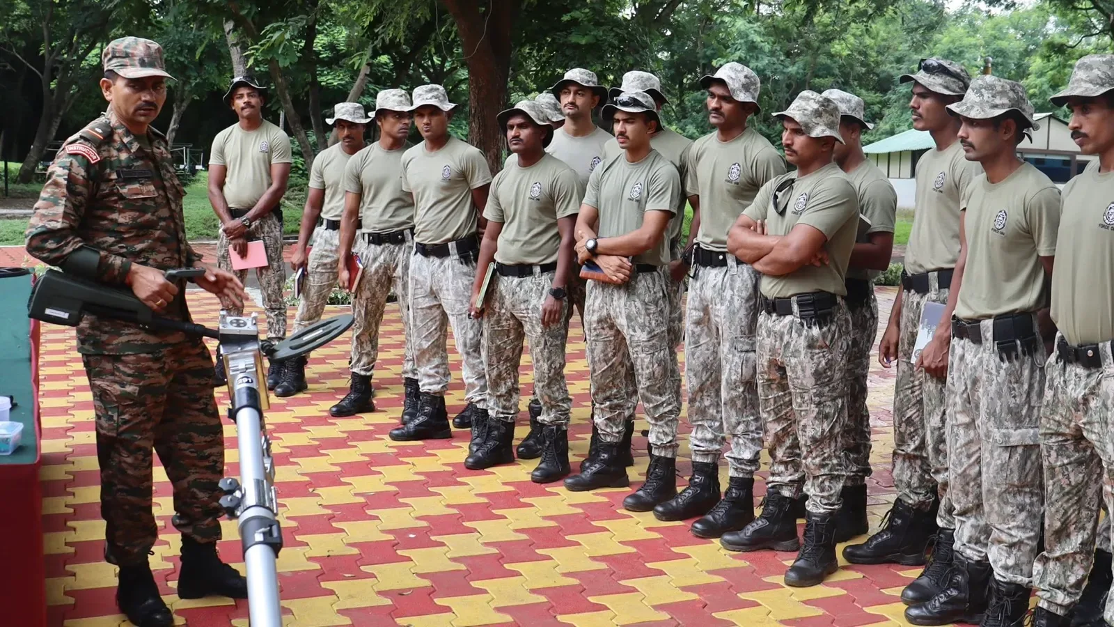 Trainer guiding aspirants through a strength session